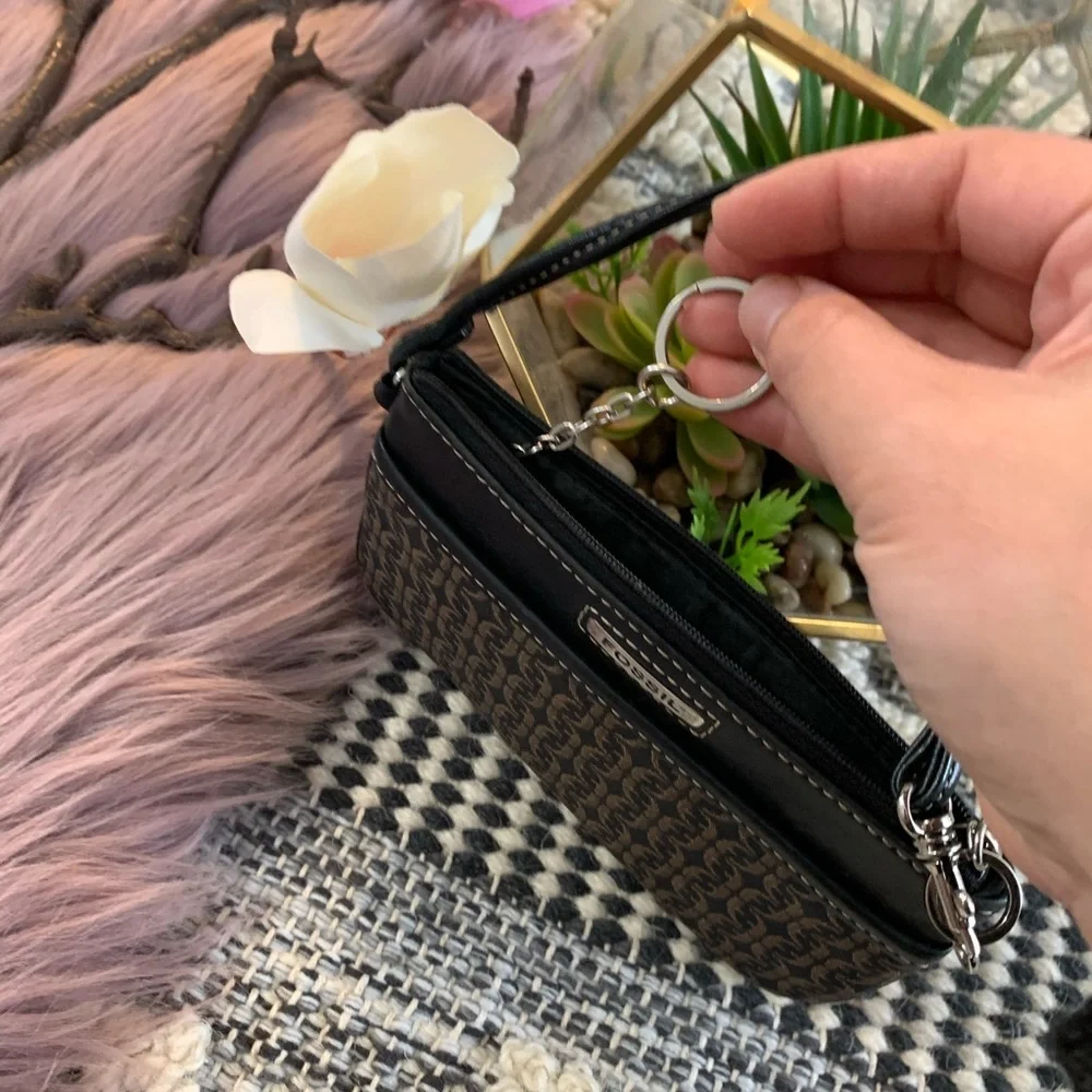 Fossil key chain and logo wristlet.